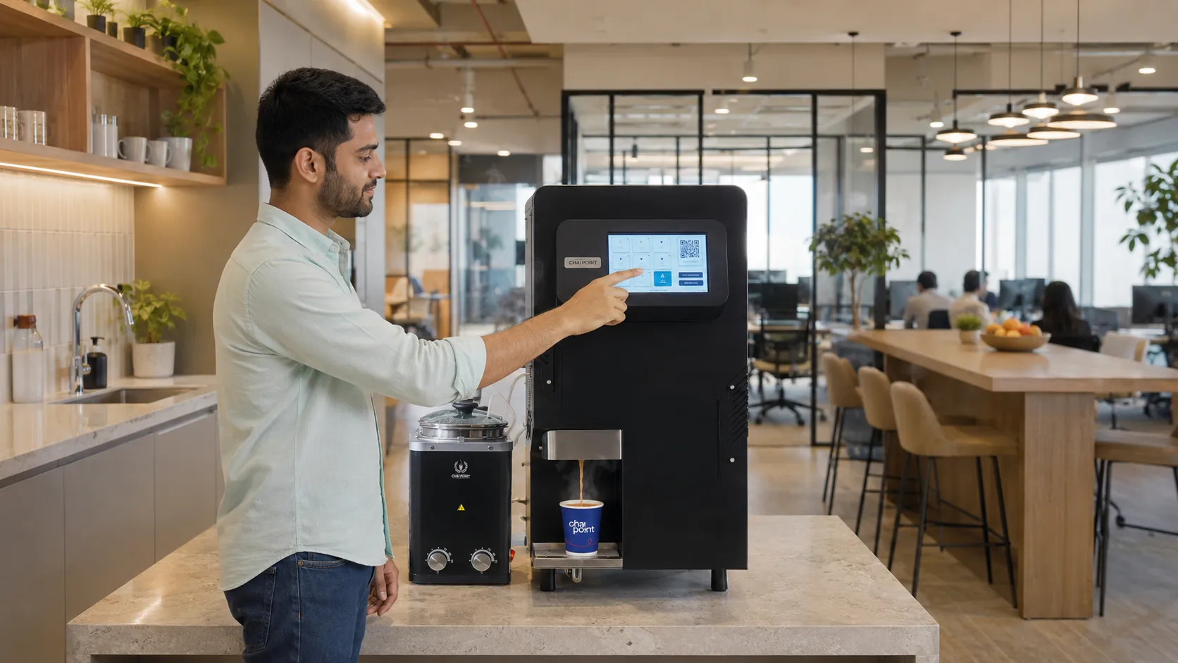 A Brewing Bot on an office floor dispensing chai